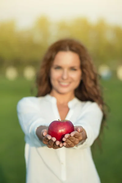 Woman with apple Royalty Free Stock Photos