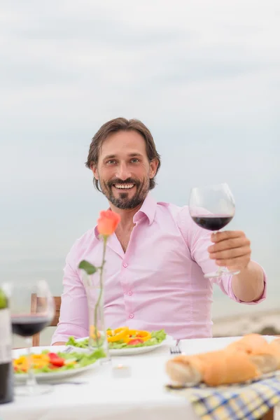 Handsome man drinking wine — Stock Photo, Image