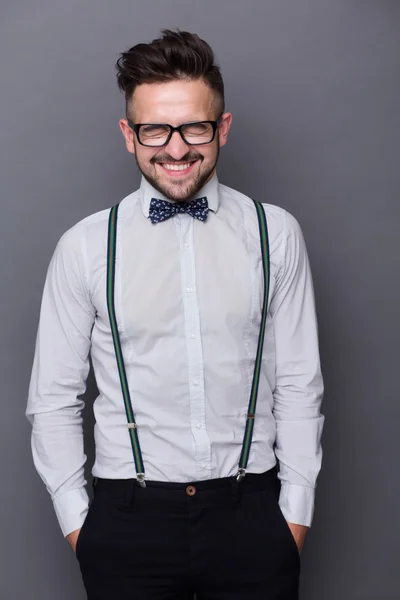 Smiling hipster man in studio — Stockfoto