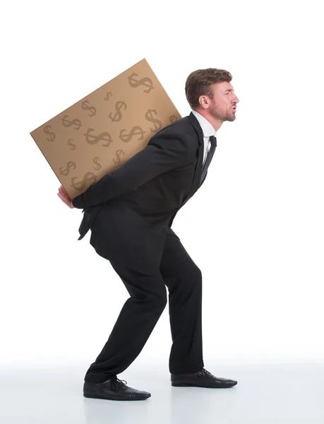 Businessman carrying heavy load with money on his back — Stock Photo, Image