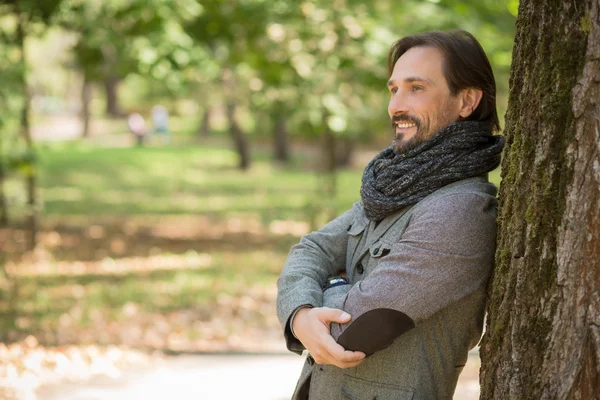 Portrait of handsome middle-aged man in the park — Stock fotografie