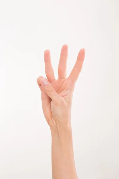 Mão das mulheres representando três dedos — Fotografia de Stock