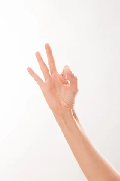 Mujer mostrando tres dedos — Foto de Stock