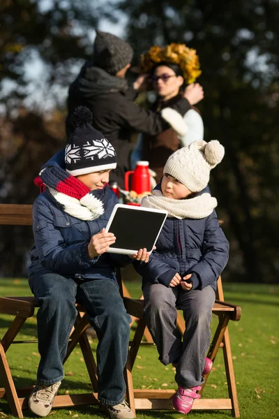 Little children sitting all together with tablet PC — Stock Fotó