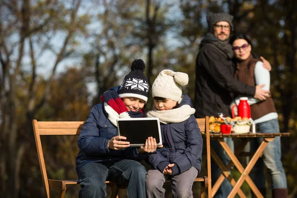 Little children sitting all together with tablet PC — Stock Fotó