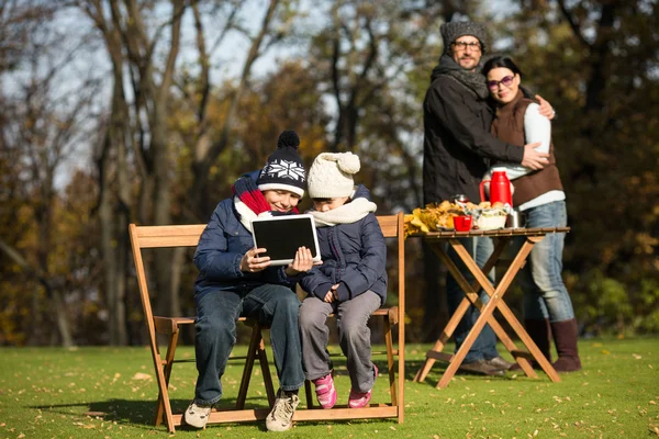 Little children sitting all together with tablet PC — Stock Fotó