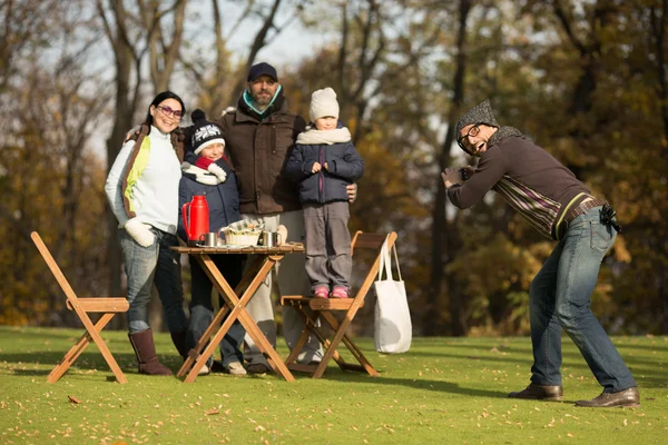 Young family spending time on a picnic with friends — Stock Fotó