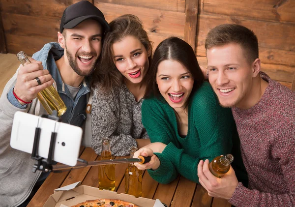 Happy friends making top view selfies in pizzeria — Stock Photo, Image