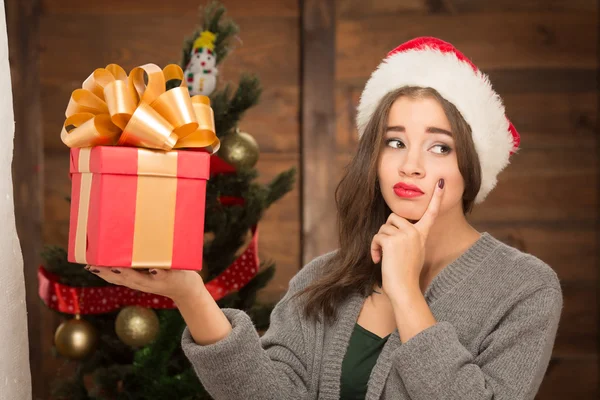 Beautiful girl holding a present — Stock Photo, Image