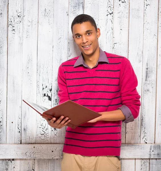 Handsome man with register or journal — Stock Photo, Image