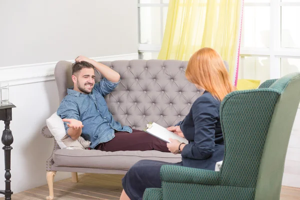 Handsome man at the psychotherapist — Stock fotografie