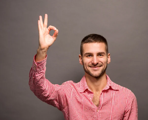 Handsome man showing okay sign — Stock Photo, Image