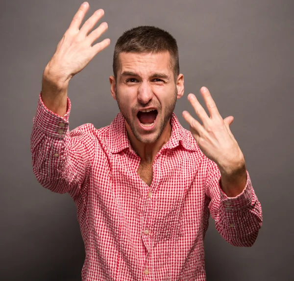 Young man with his hands in air — Stock Photo, Image