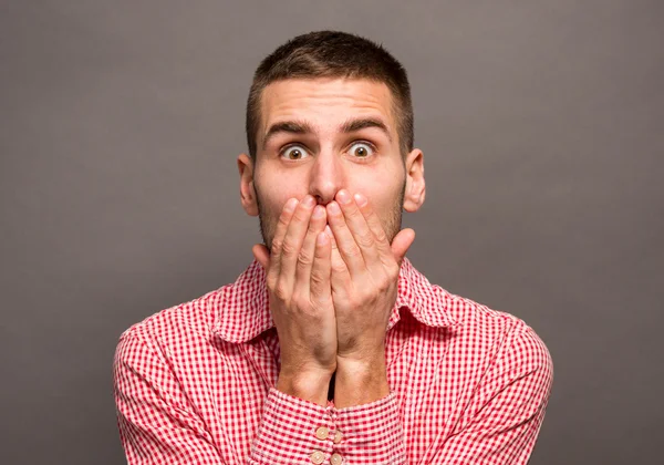 Man covering his mouth — Stock Photo, Image
