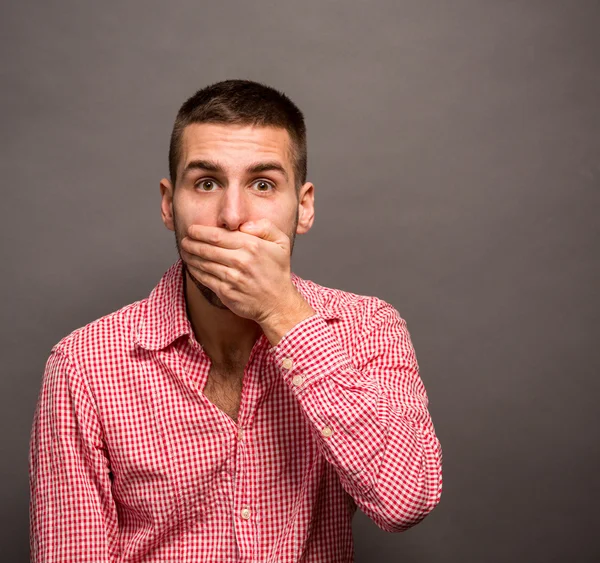 Man covering his mouth — Stock Photo, Image