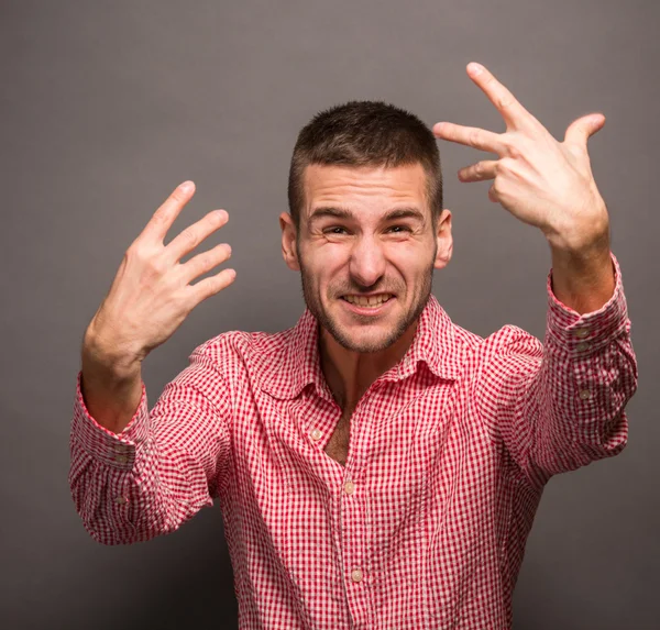 Young man with his hands in air — Stock Photo, Image