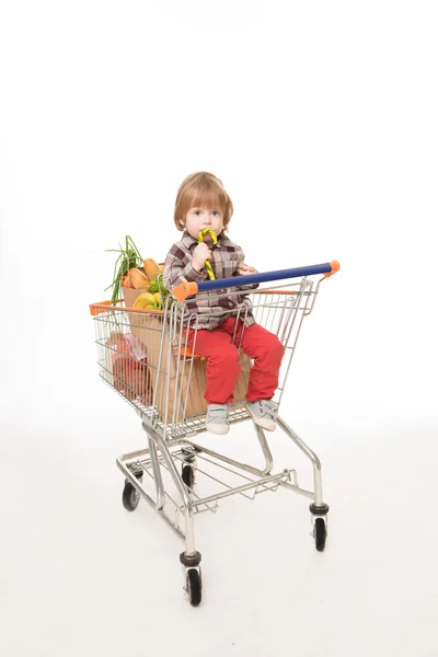 Baby sitting in shopping cart — 图库照片