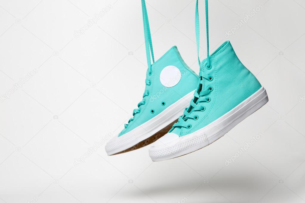 Pair of shoes with laces over white background