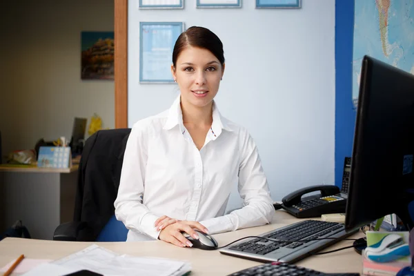 Young pretty business woman at workplace in office — Stock Photo, Image