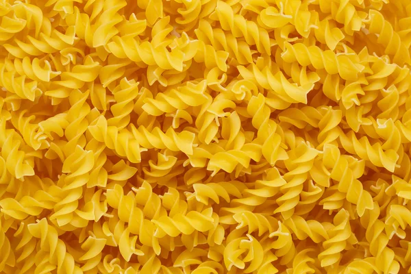 Pasta Fussili achtergrond — Stockfoto