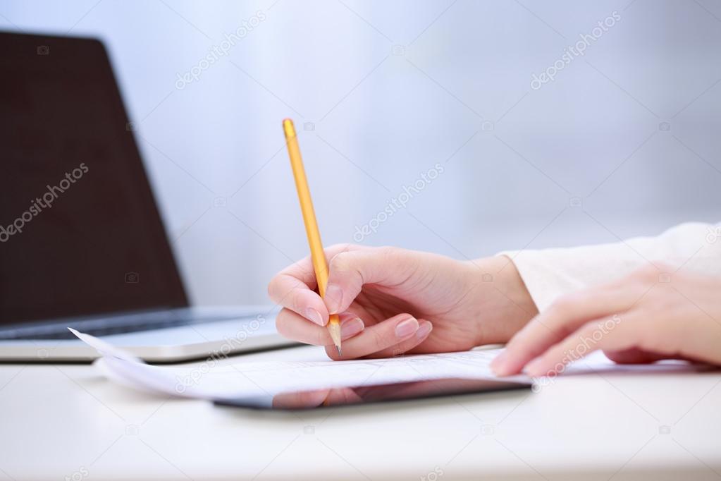Female hand writing, close up