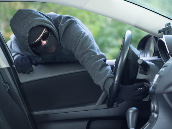 Burglar wearing mask balaclava, car burglary