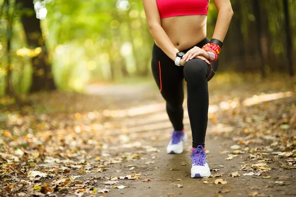 Woman exercising and stretching muscles — Stock Photo, Image