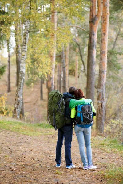 Woman and man hugging from back — Stock Photo, Image