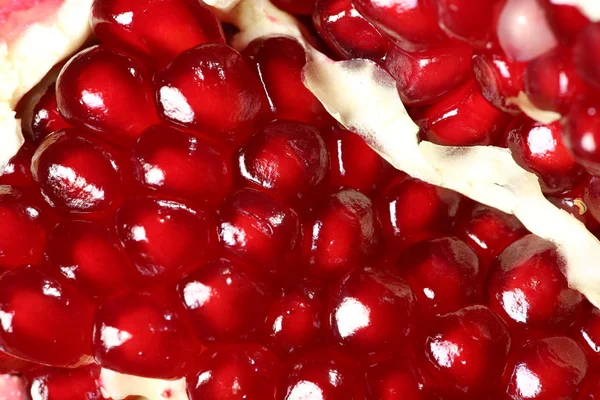 Ripe and juicy pomegranate broken into pieces, closeup — Stock Photo, Image