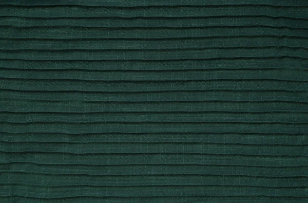 Groene gevouwen stof — Stockfoto