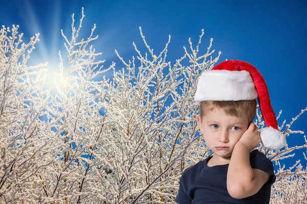 The boy in  Christmas hat — Zdjęcie stockowe