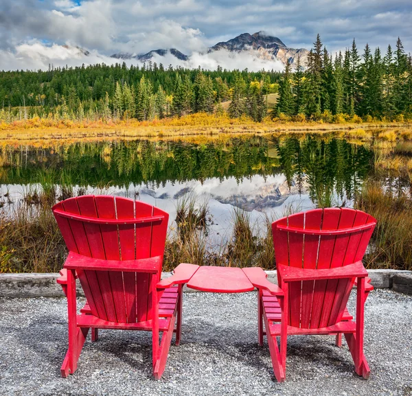 Two red plastic chairs — Stock Photo, Image