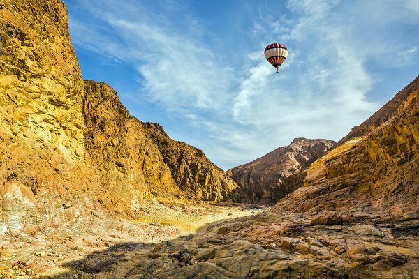 multi-colored balloon over the hot desert