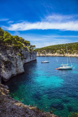 White sailing boats waiting for tourists