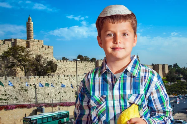 Boy in white festive skullcap with etrog — Stock Photo, Image