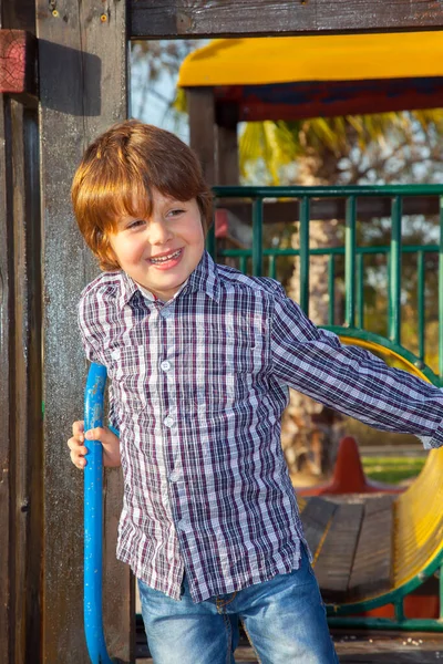 Charming Boy Jeans Camisa Vaquero Cuadros Juega Alegremente Parque Infantil — Foto de Stock