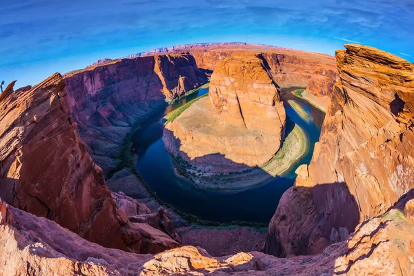 USA, Arizona, Glen Canyon Recreation Area. Horseshoe Bend is a beautiful meander of the Colorado River. Deep canyon of red sandstone. Concept of active and photo tourism