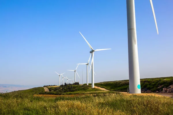 Israel. The concept of environmental protection and photo tourism. Modern equipment for generating electric energy. Modern windmills. Wind generator - wind farm on Mount Gilboa