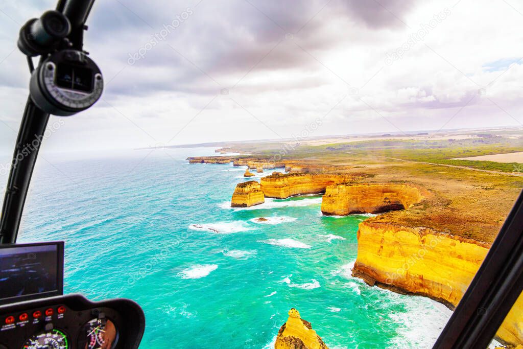 Helicopter flight over the scenic Pacific coastline. The fabulous journey to Australia. Legendary cliffs 