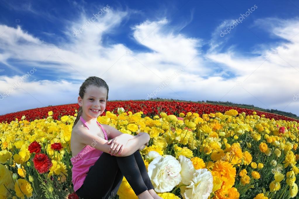 Girl in buttercups field