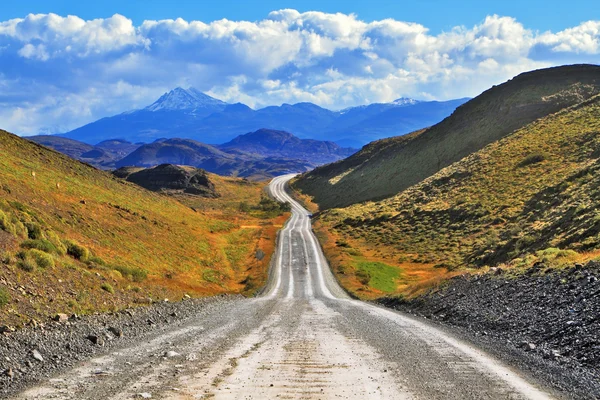 Snow-covered black rocks road — Stock Photo, Image