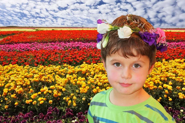 Handsome boy with wreath of flowers — Stock Photo, Image