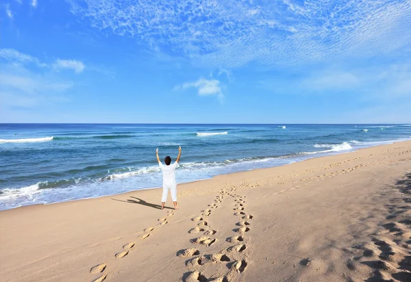 Woman in white doing yoga — Stock Photo, Image