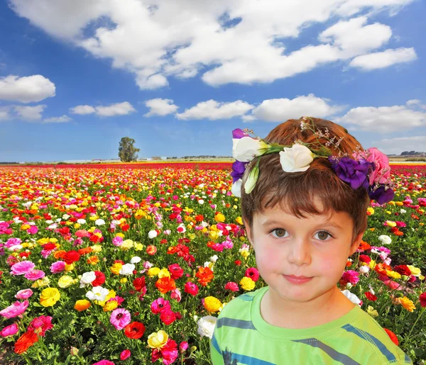 The charming little boy in flower garland — Stock Photo, Image