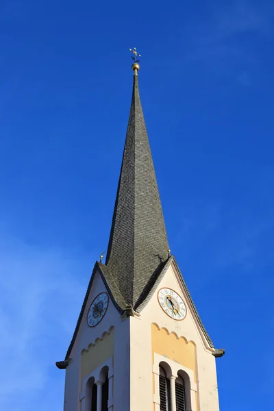 Elegant bell tower and Lutheran church — Stock Photo, Image