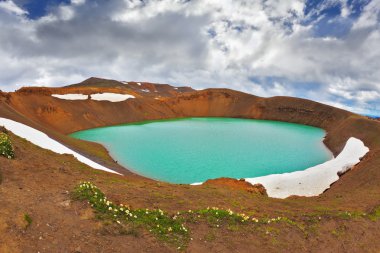 Lake in the crater of an extinct volcano clipart