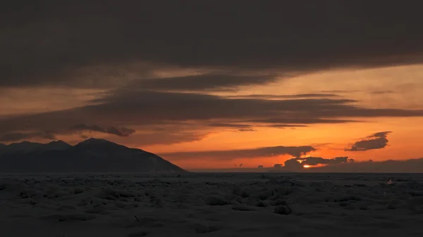 Sunset on a background of the Holy Nose Peninsula. — Stock Photo, Image