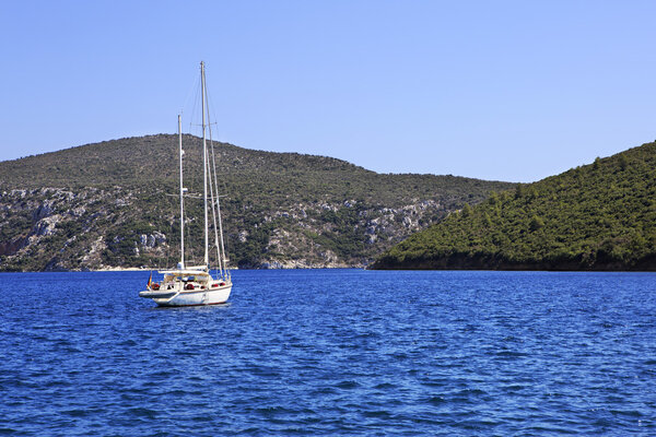 Two yachts in the bay of Aegean Sea.