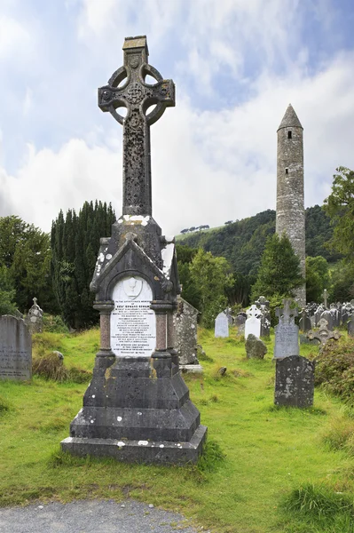 Celtic cemetery and a round tower — Stock Photo, Image