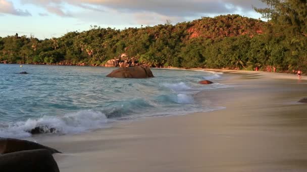 Waves at sunrise on the beach Anse Lazio. — Stock Video